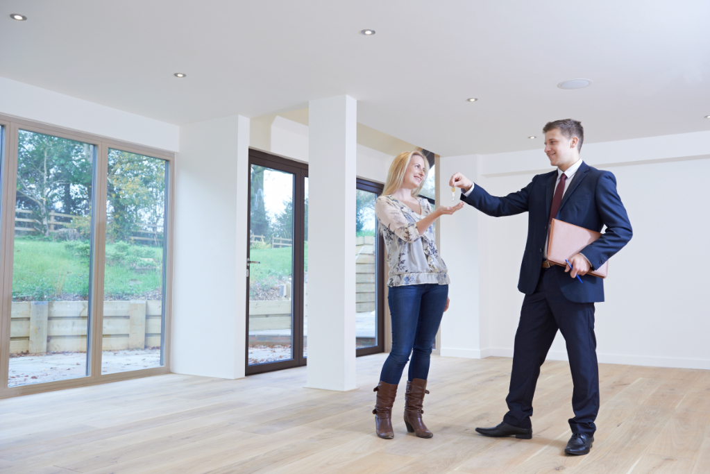 Realtor Giving key to Woman